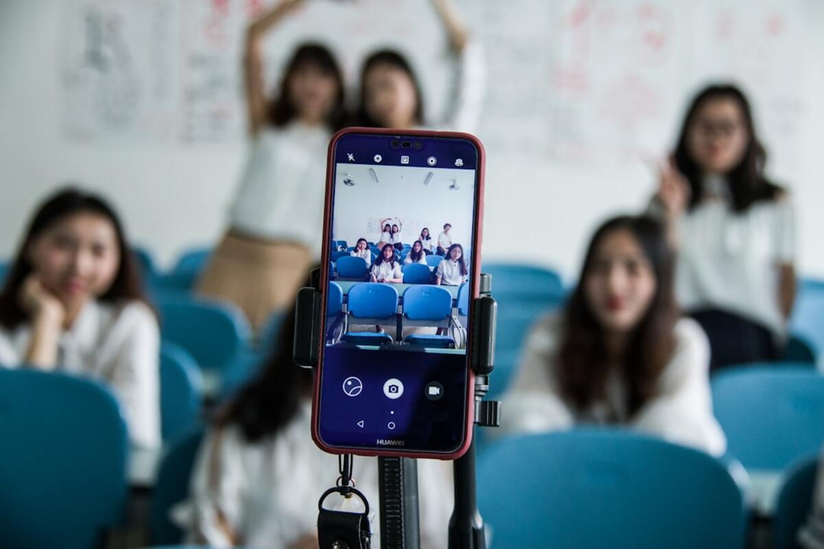 Students using augmented reality tools in a classroom to explore STEM subjects.